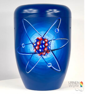 Die fertige Bio-Urne Atom. Das Molekül in den Farben Blau und Rot. Im Hintergrund strahlt der Lichtkreis.